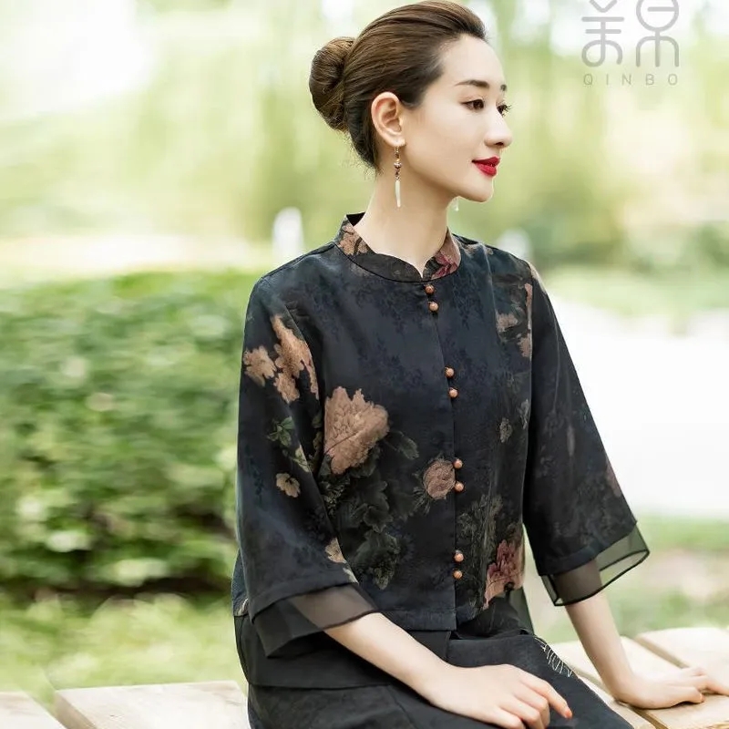 ดอกไม้ทะลุรู Luo ผ้าไหมเสื้อผู้หญิง 2022 ฤดูร้อนใหม่หลวมสไตล์จีนคอปกสามในสี่แขนเสื้อ