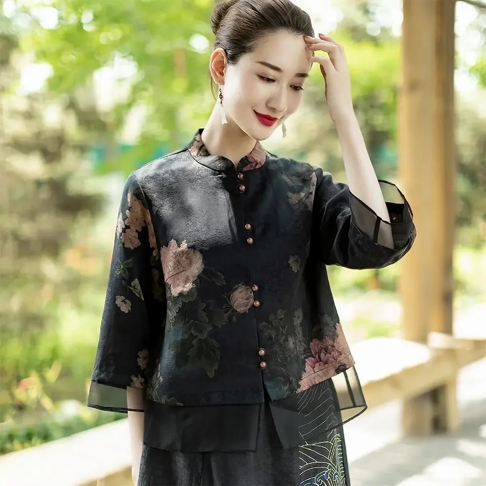 ดอกไม้ทะลุรู Luo ผ้าไหมเสื้อผู้หญิง 2022 ฤดูร้อนใหม่หลวมสไตล์จีนคอปกสามในสี่แขนเสื้อ